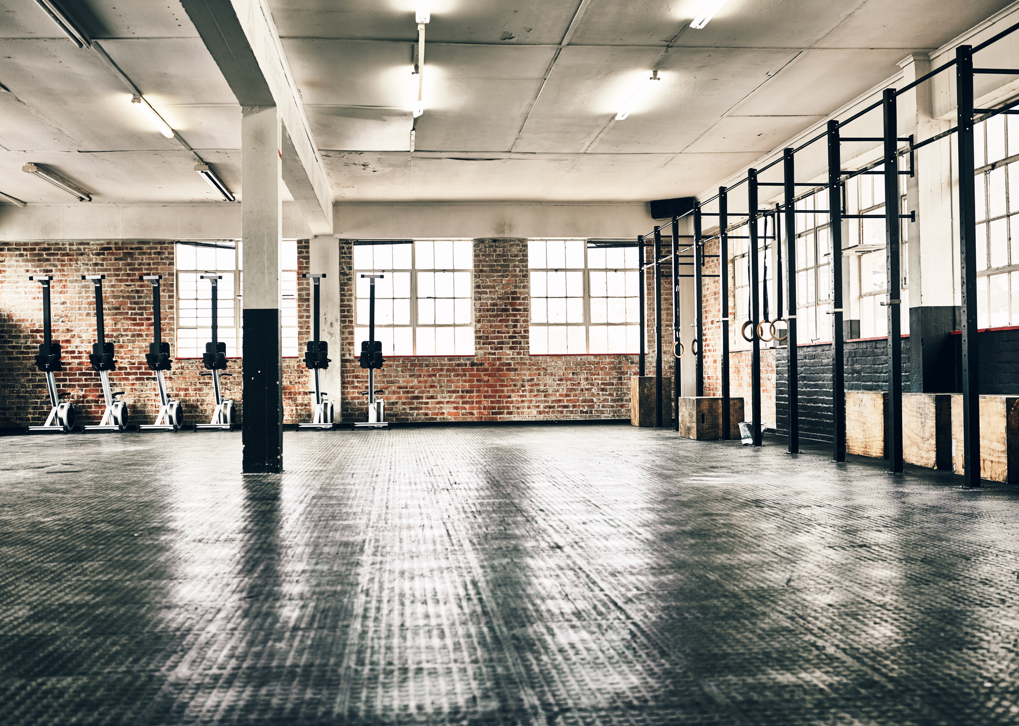 Shot of the interior of a health club full of gym equipment