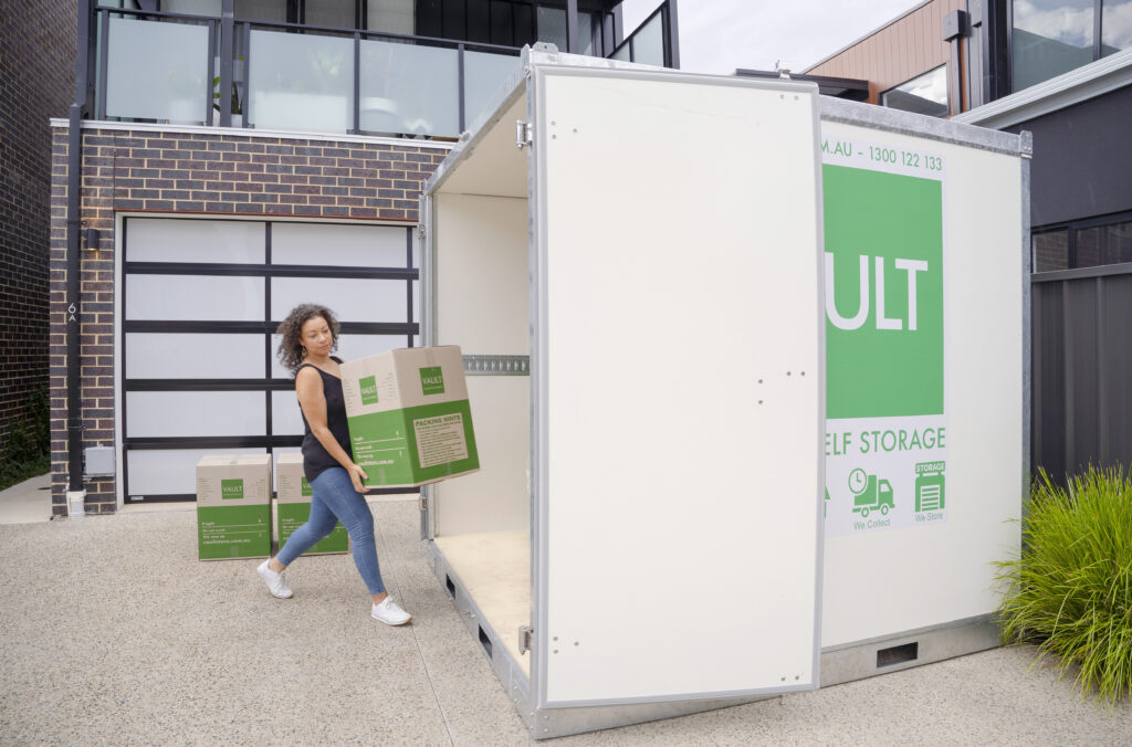 A Lady Carrying vault store box bringing inside a vault mobile storage